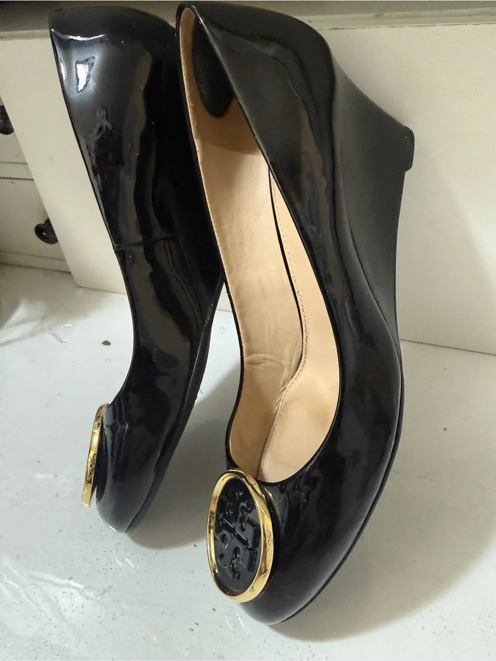 Tory Burch Black Patent Leather Wedge Flats with Gold Logo Medallions